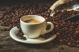 Coffee cup with roasted beans and jute sack 