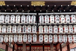 Traditional japanese lanterns hanging at the entrance of a templ