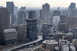 Elevated highway curving through the dense urban center of osaka
