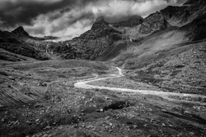 mountains and stream near the fellaria glacier.
