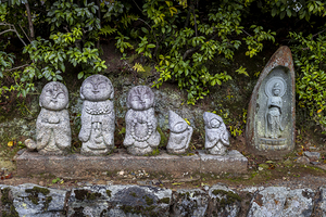 Jizo statues protecting cemetery in rural japan 