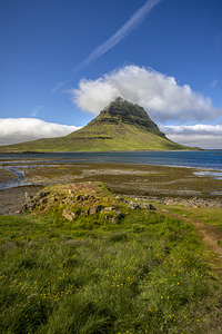 Kirkjufell mountain reflecting in the calm water