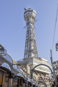 Tsutenkaku tower rising above shinsekai district in osaka japan