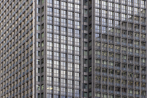 modern office buildings showing repeating glass windows and meta
