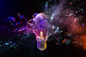 Light bulb exploding with colorful powder effect