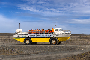 Tourists enjoying amphibious vehicle trip in iceland
