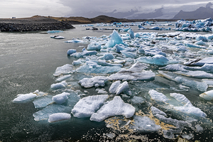 Icebergs floating in jokulsarlon glacier lagoon in iceland under