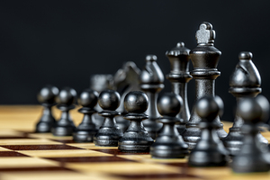 Chess pieces standing on chessboard