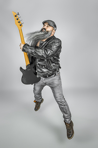 rocker with guitar and long beard 