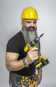 handyman with electric screwdriver