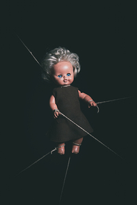 old doll tied 
