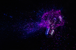 explosion of an electric light bulb on black. 