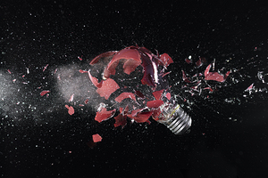 impact explosion of a red light bulb 