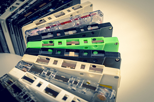 background with old audio cassettes of various colours