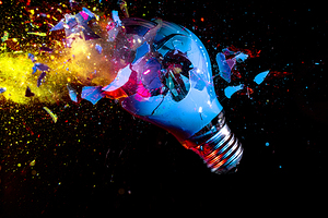 colorful electric light bulb exploding