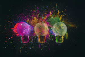 explosion of 3 colored light bulbs 