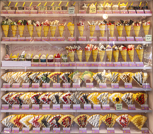 Shop window with multitude of crepes in various flavours