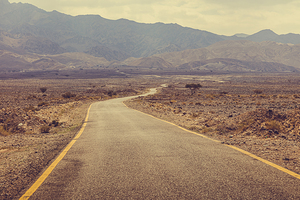 desert road leading to wadi rum Jordan.