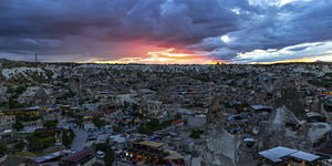panoramic view of the city of goreme at sunset.