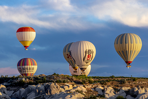 Hot air balloons fly over Goreme. Turkey