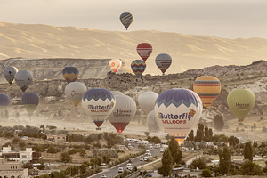 colorful hot air balloons take flight over the city of goreme at