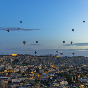 hot air balloons fly at sunrise