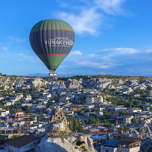 hot air balloons fly over the town
