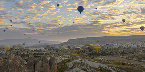 hot air balloon flies in the sky at dawn