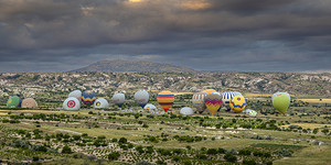 hot air balloons prepare to rise into the sky