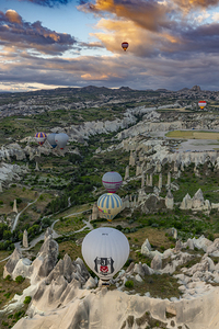 colorful hot air balloons fly at sunrise near goreme vie from b