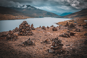 view of a river and multiple piles of stones on the road to Saks
