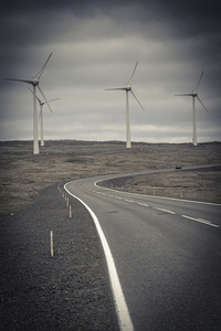 desolate road and wind turbines 