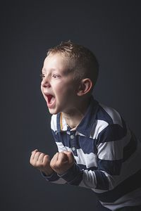 6 year old kid caucasian boy screaming in despair.