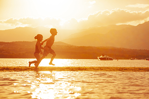 children run on the beach