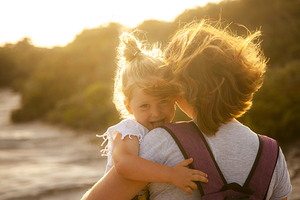 portrait of a 3 year old Caucasian girl with blond hair who show