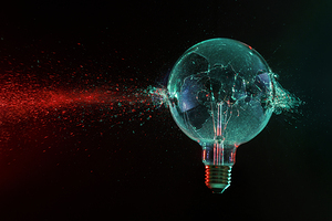 large green bulb exploding on a black 