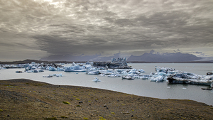 Icebergs floating on jokulsarlon glacier lagoon with storm appro