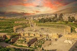 tourists at the ruins of Jerash at sunset