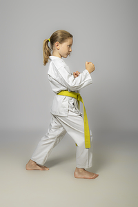 child practises martial arts