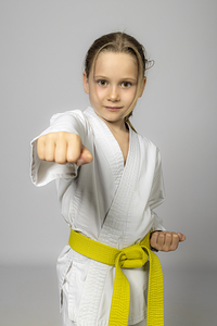 Caucasian girl practises karate