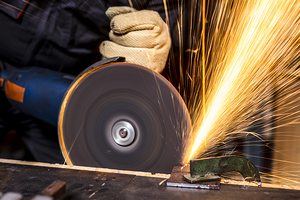 man with grinder in action