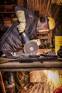 man with grinder in action