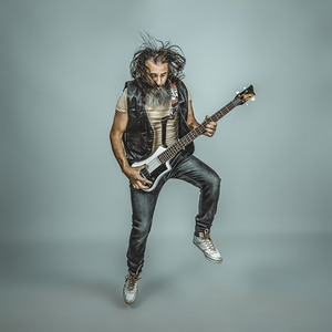 musician with long hair and beard