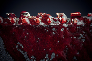 detail of the teeth of a bloody chainsaw blade background