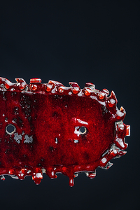 detail of bloody chainsaw 