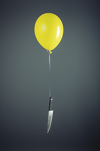 Large knife tied to a yellow balloon