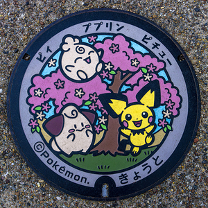 manhole cover depicting Pokemon characters