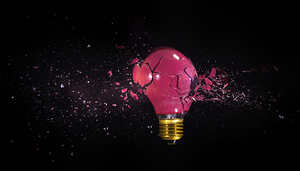 breaking of a red bulb on a black background. 