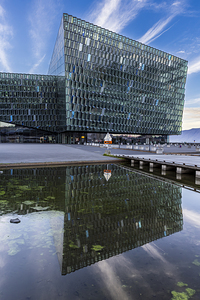 Harpa concert hall and conference centre reflecting in water on 