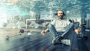 man sitting underwater who relaxes in a yoga position. 